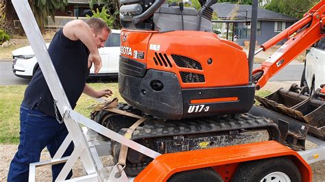 securing mini excavator to trailer|how to tie an excavator.